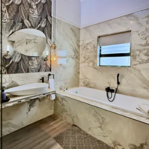 Birch Luxury Studio marble bathroom with a deep bath
