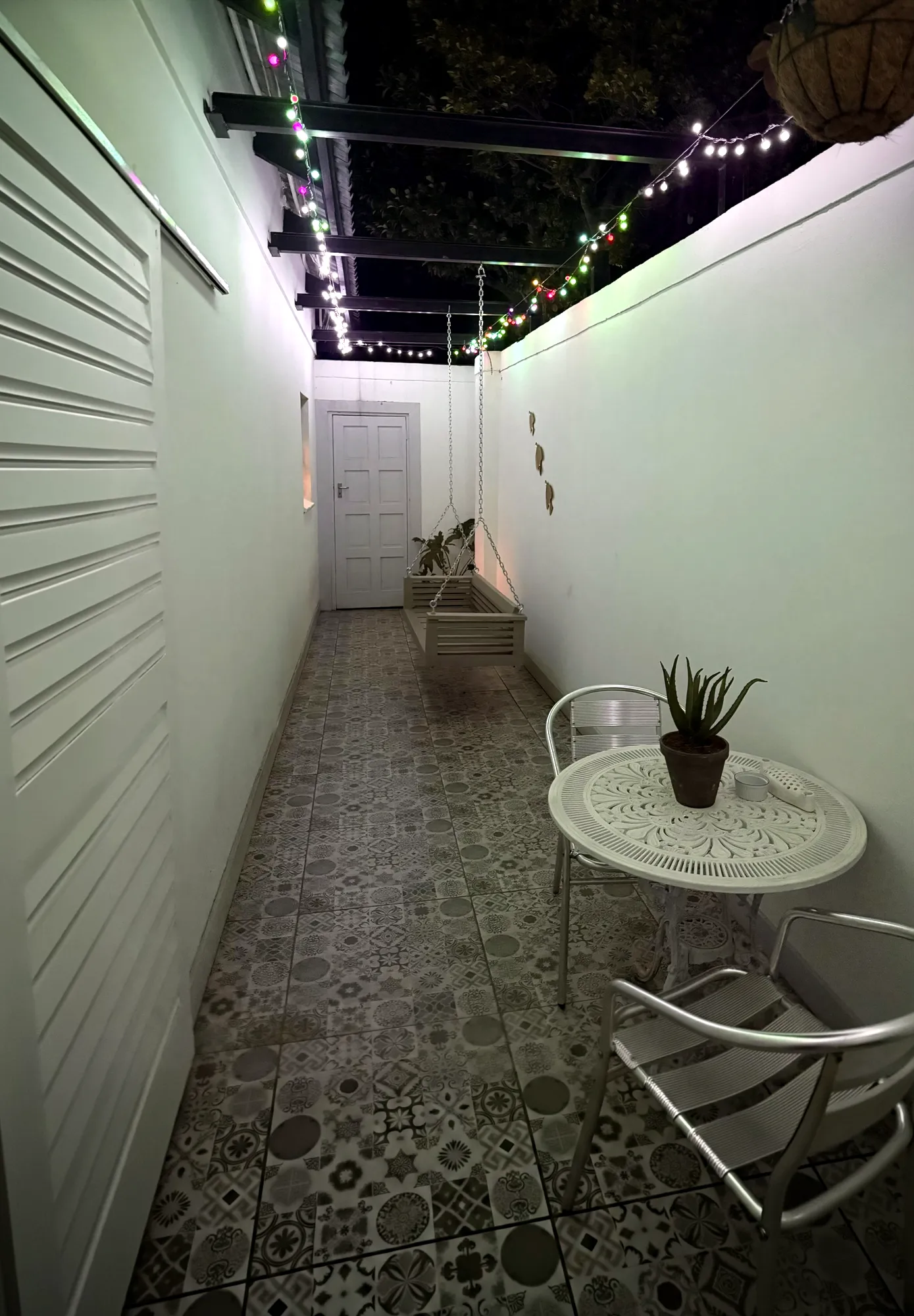 Birch Luxury Studio's private patio strung with fairy lights
