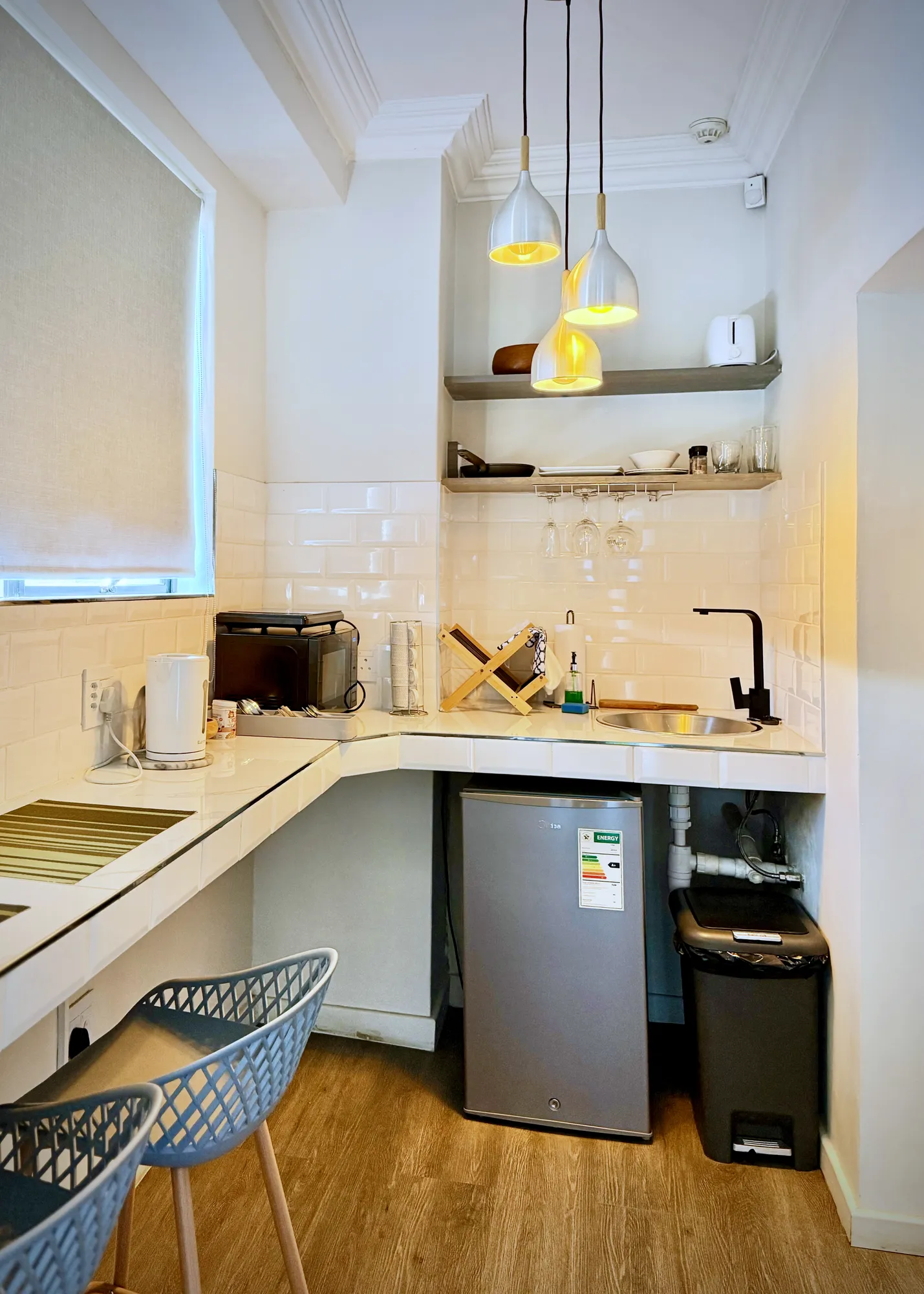 Cedar Luxury Studio kitchenette with full-length counter and pendant lights
