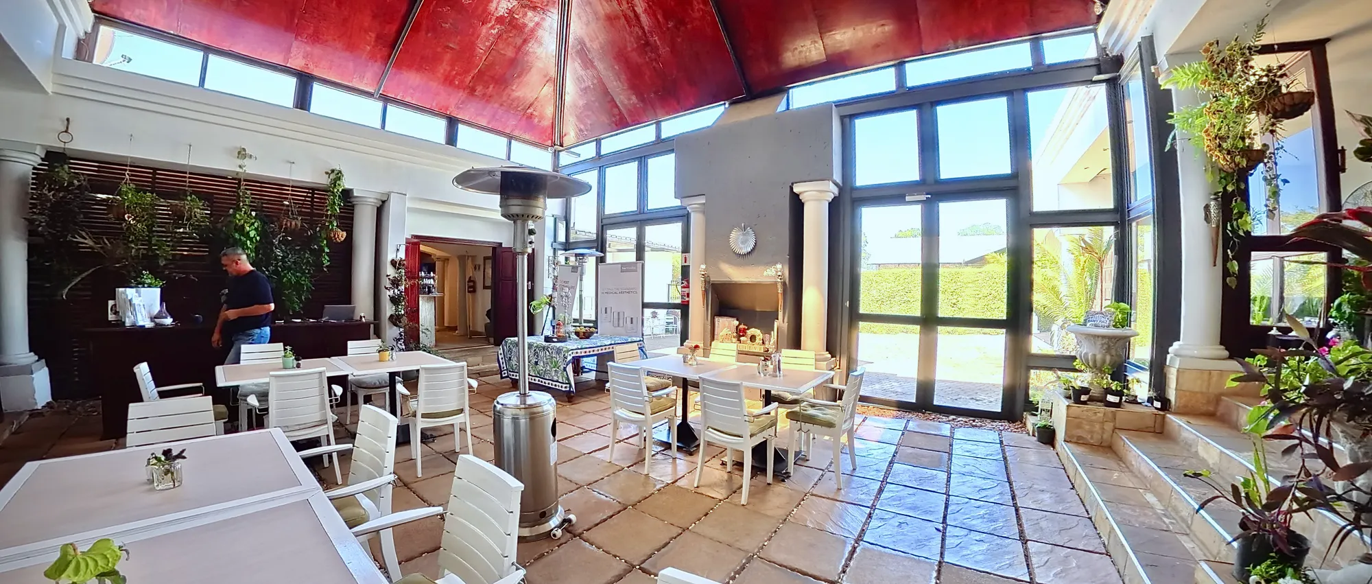 The courtyard breakfast area under its red glass roof