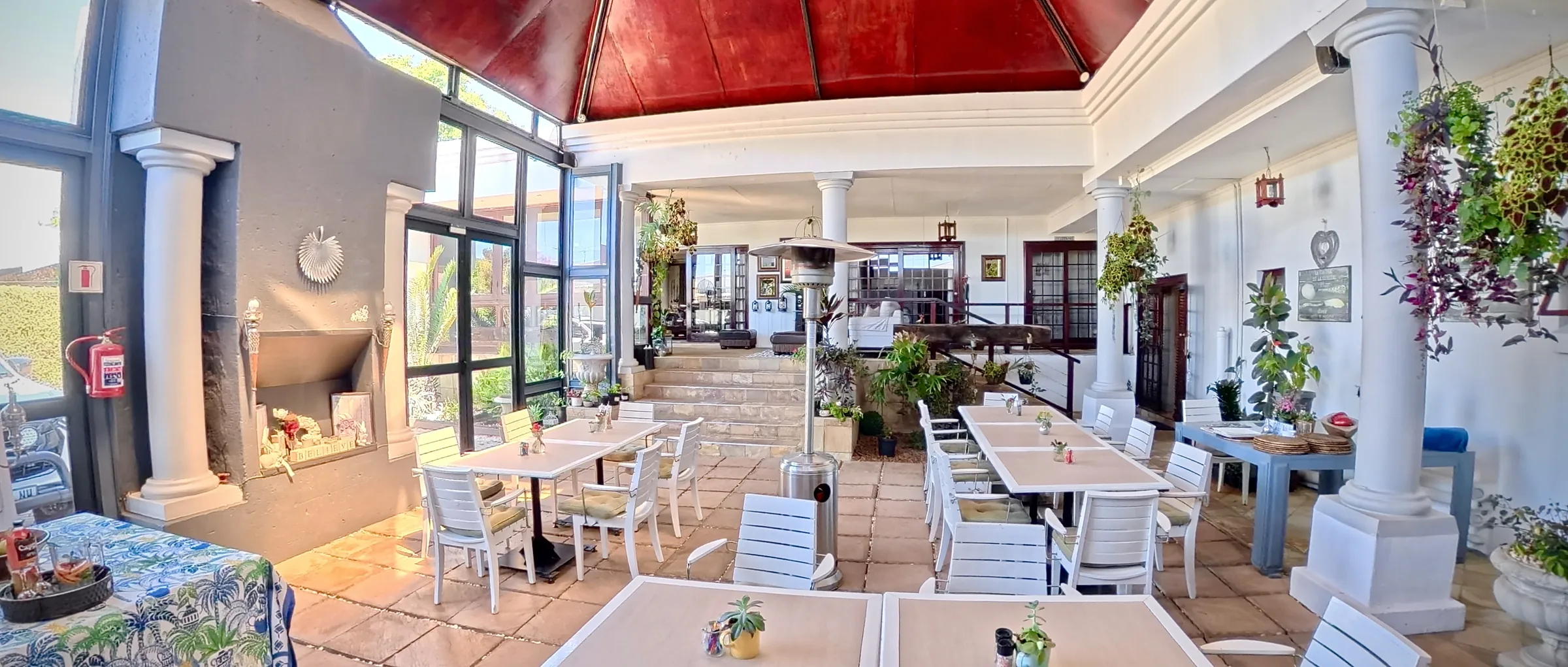 The courtyard breakfast area under its red glass roof