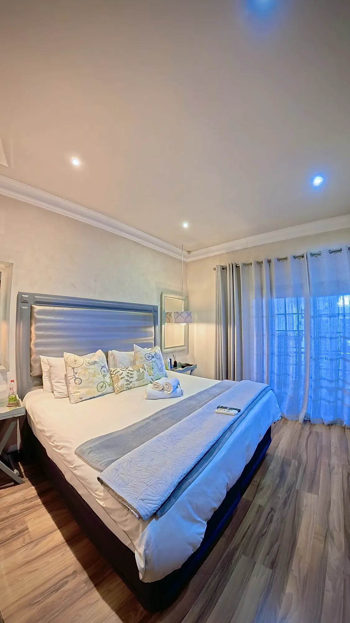 Luxury South Suite bed with grey upholstered headboard
