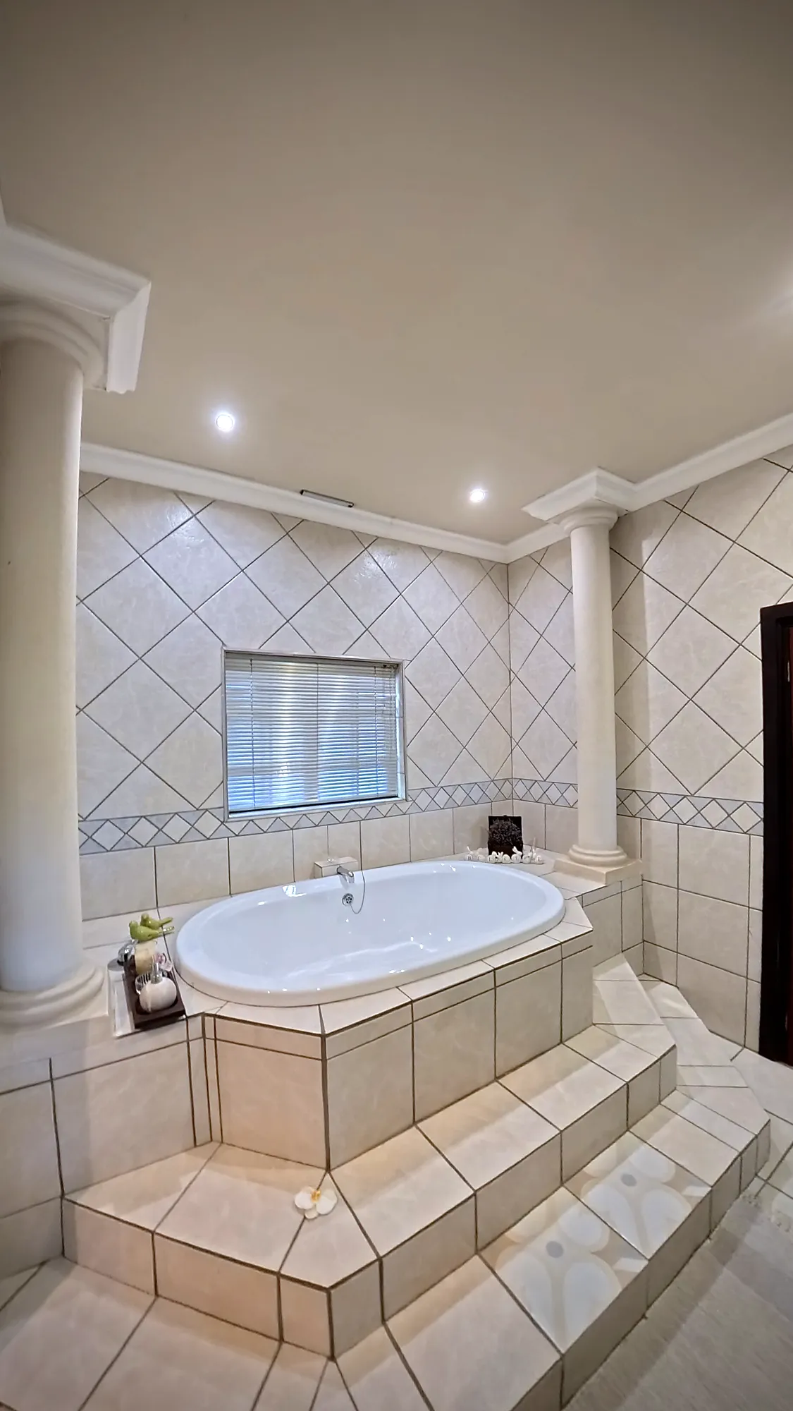 Luxury West Suite raised bath in the palatial bathroom